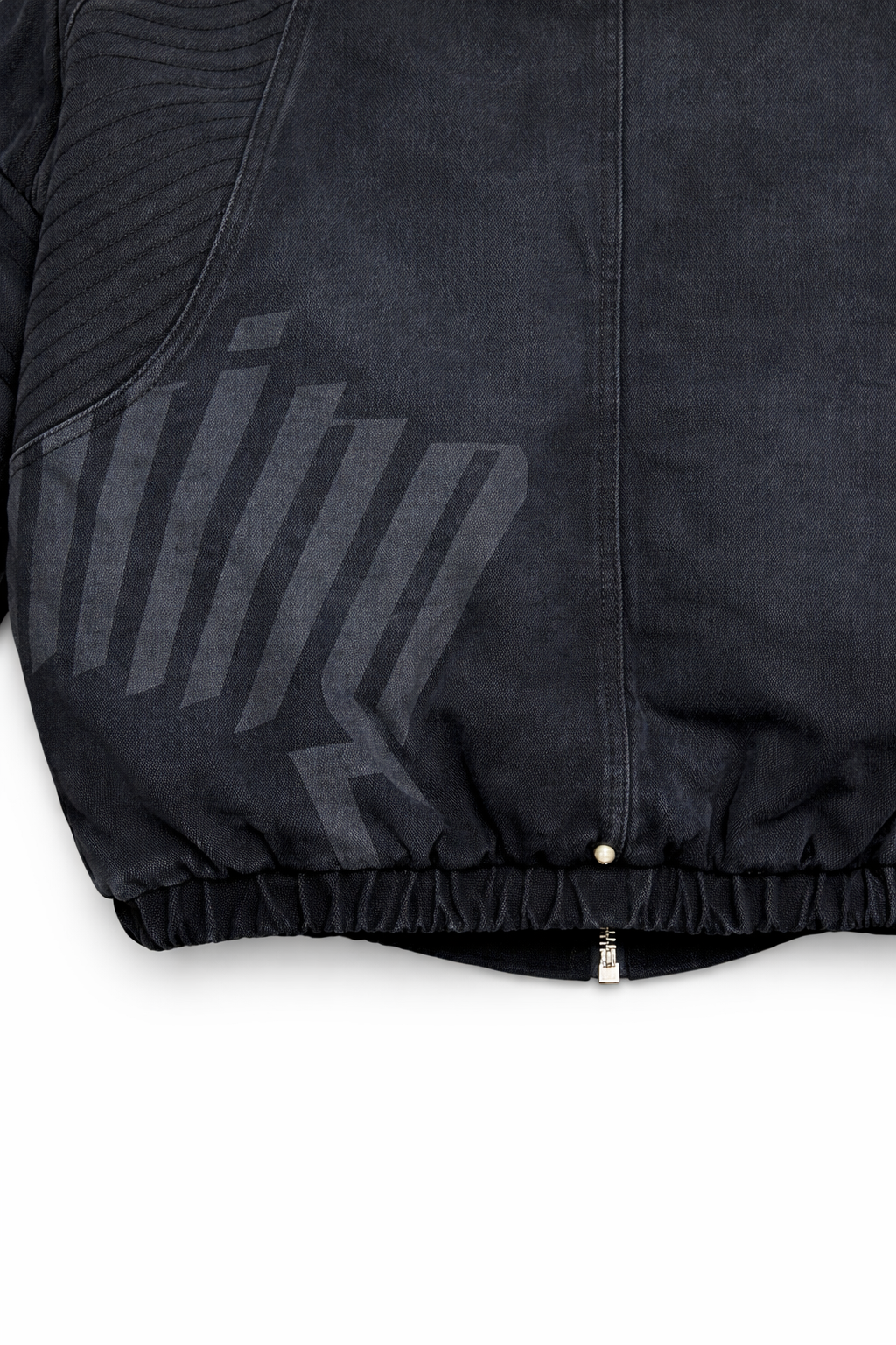 Close-up of a black jacket with a brand logo on a white background