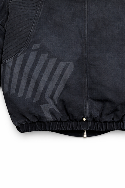 Close-up of a black jacket with a brand logo on a white background