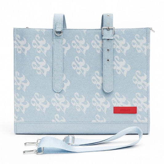 Light blue tote bag with white pattern and red label on a white background